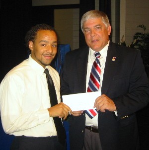 In May, Kendall DeJesus receives a $1,000 scholarship from Budura.